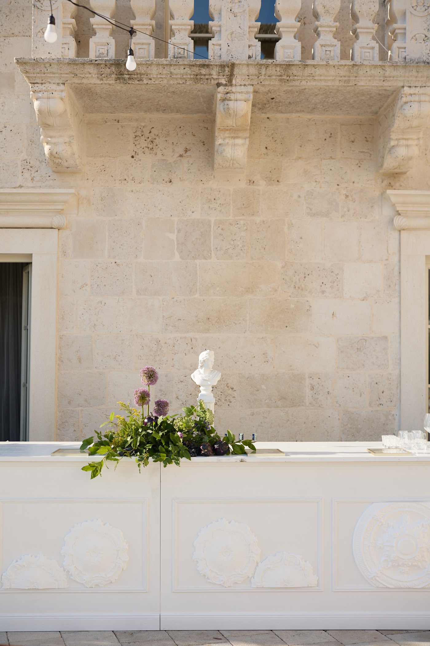 White wooden bar with decorative rosettes