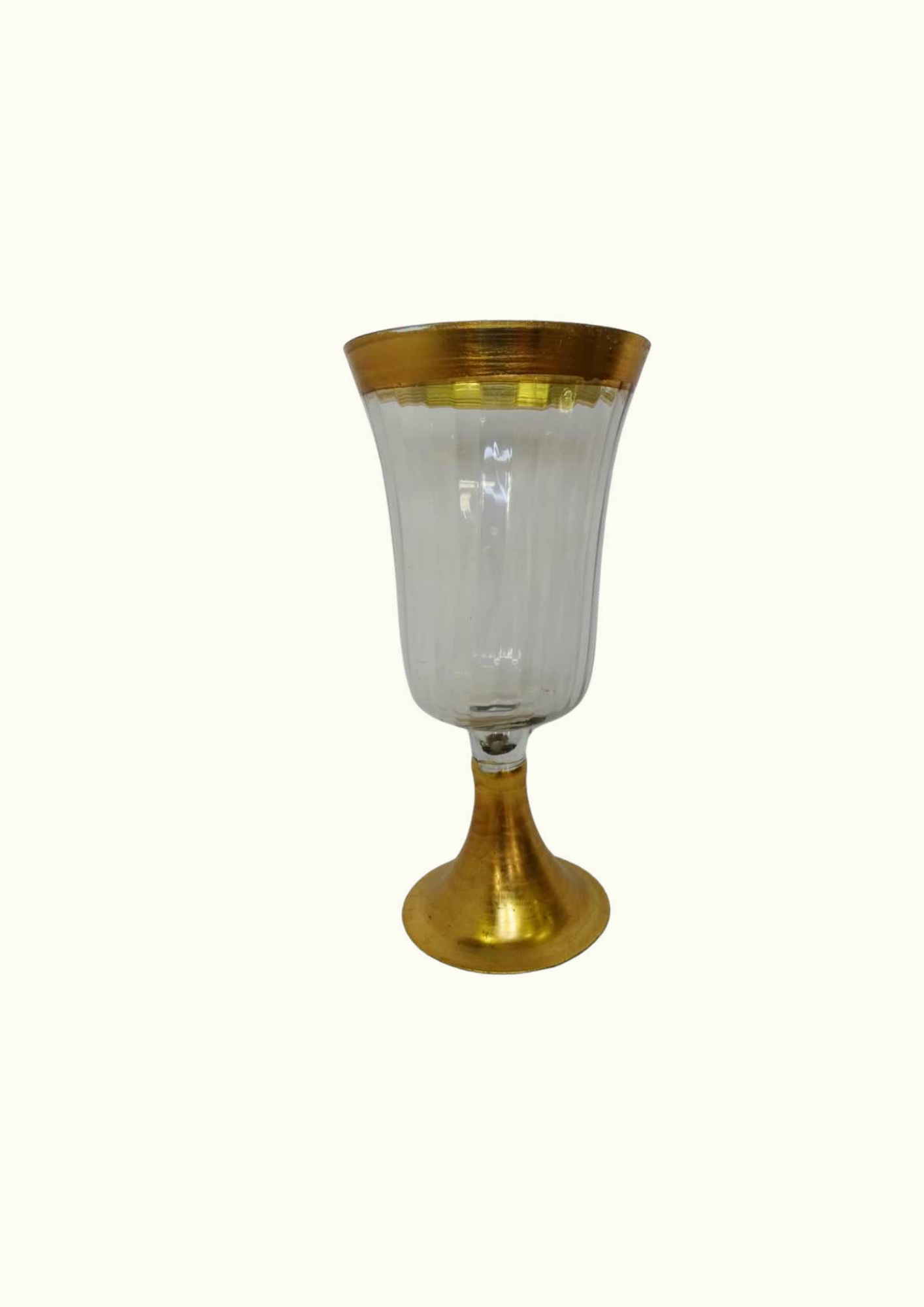Glass vase on a pedestal with a gold rim