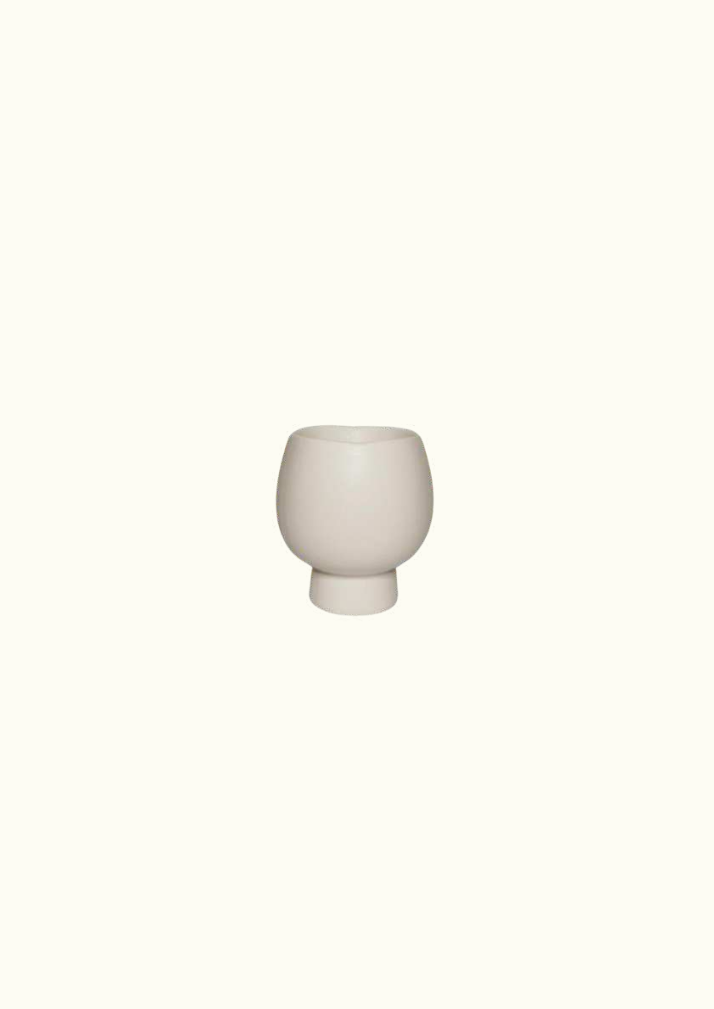 White ceramic vase on the stand
