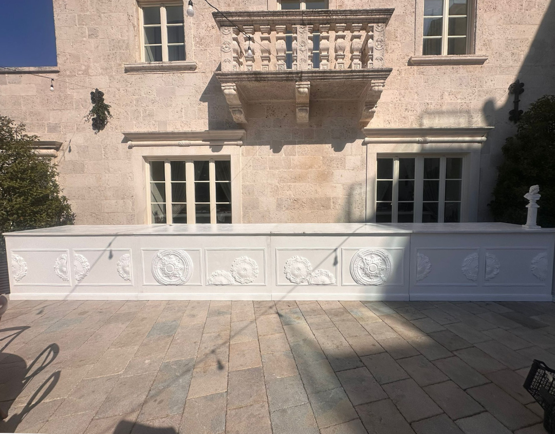 White wooden bar with decorative rosettes